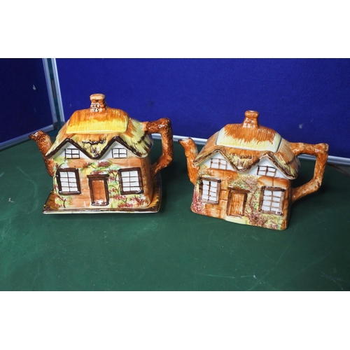 670 - 2 Cottage ware teapots.