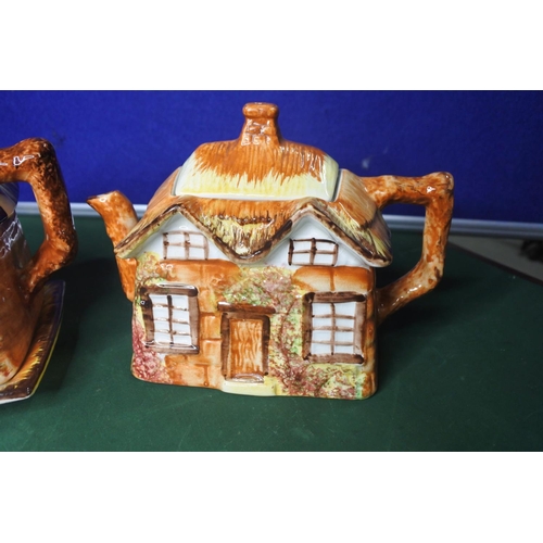 670 - 2 Cottage ware teapots.