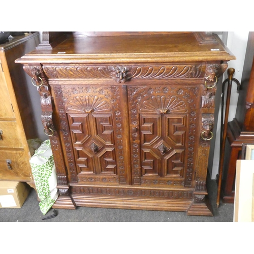 678 - A stunning antique Gothic style cabinet with heavily carved detail & stained glass doors.