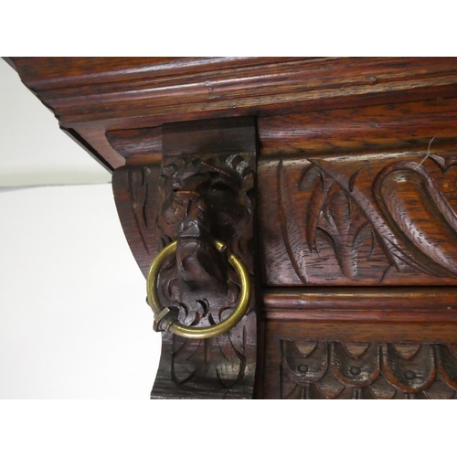 678 - A stunning antique Gothic style cabinet with heavily carved detail & stained glass doors.