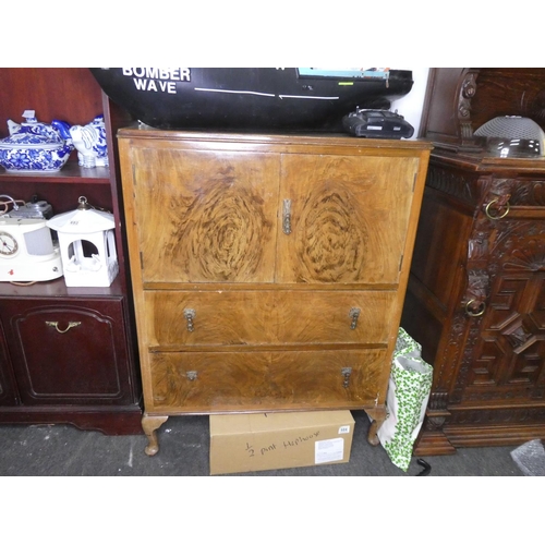 683 - An antique style cocktail cabinet.