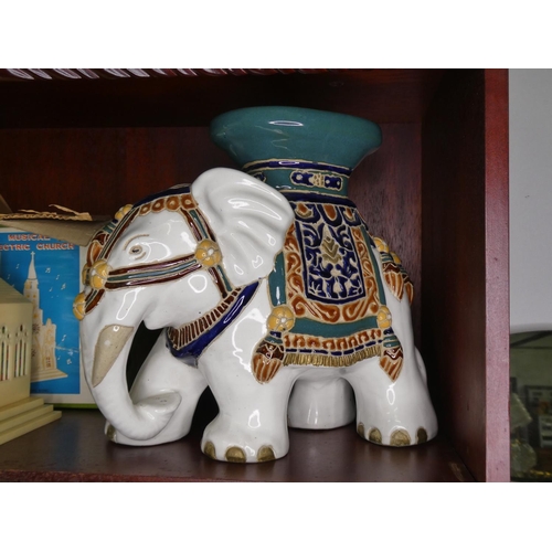 687 - A ceramic elephant plant pot stand.