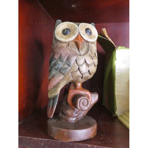 689 - A carved wooden owl.