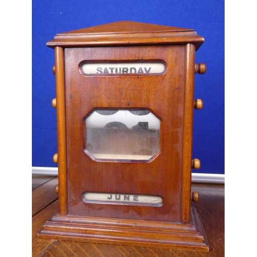 85 - An antique oak cased perpetual desk calendar.