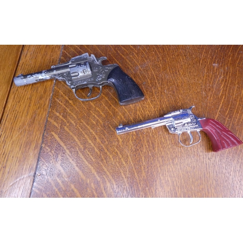 87 - 2 vintage toy guns to include Starsky & Hutch & a lone star revolver.