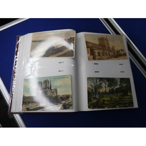 107 - A postcard album with contents.