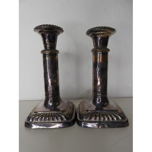 131 - An unusual pair of antique style silver plated extending candlesticks.