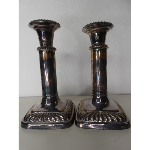 131 - An unusual pair of antique style silver plated extending candlesticks.