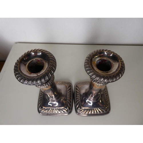 131 - An unusual pair of antique style silver plated extending candlesticks.