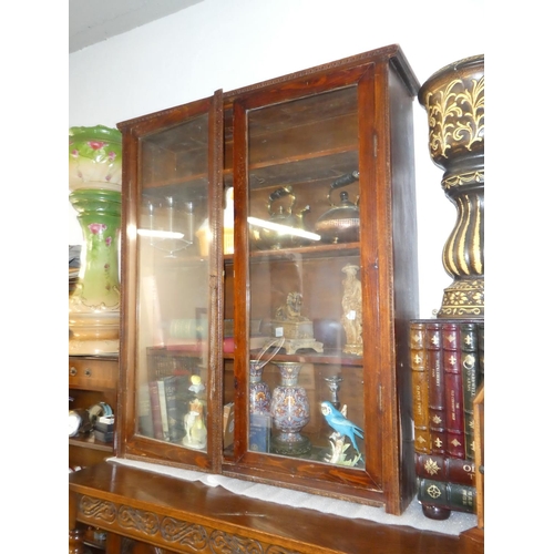 136 - An antique oak bookcase with glazed doors.