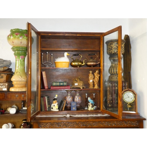 136 - An antique oak bookcase with glazed doors.