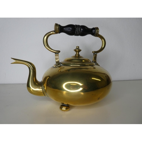 139 - An antique polished brass kettle.