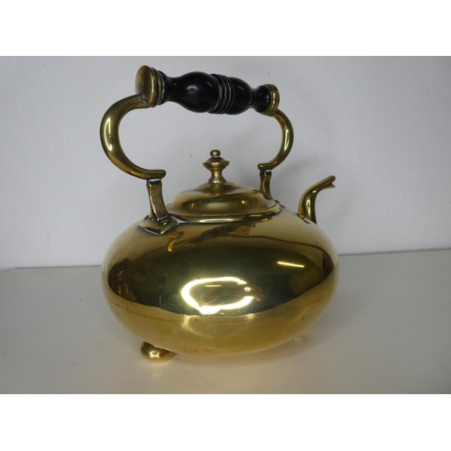 139 - An antique polished brass kettle.