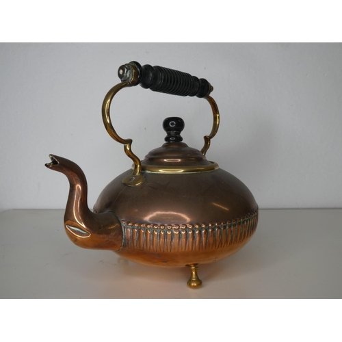 140 - An antique copper kettle.