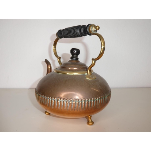 140 - An antique copper kettle.