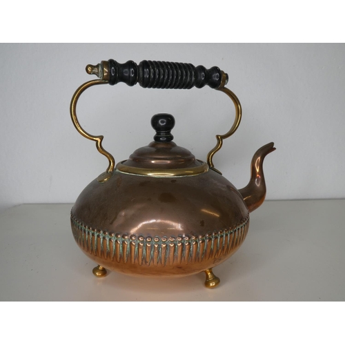 140 - An antique copper kettle.