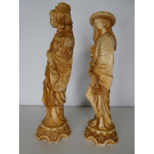 141 - A pair of decorative carved figures.