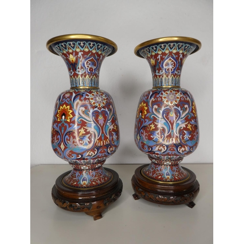 148 - A pair of decorative Oriental/ Chinese vases.