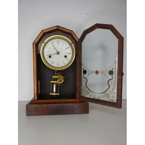 152 - An antique striking mantle clock.