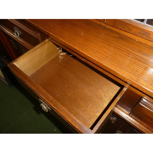 156 - A vintage Old Charm oak sideboard/ court cabinet.