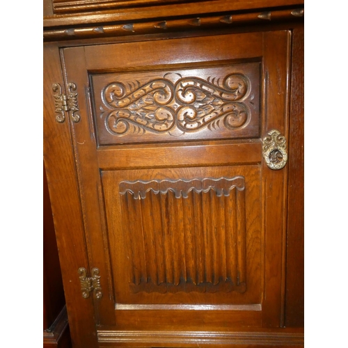 156 - A vintage Old Charm oak sideboard/ court cabinet.