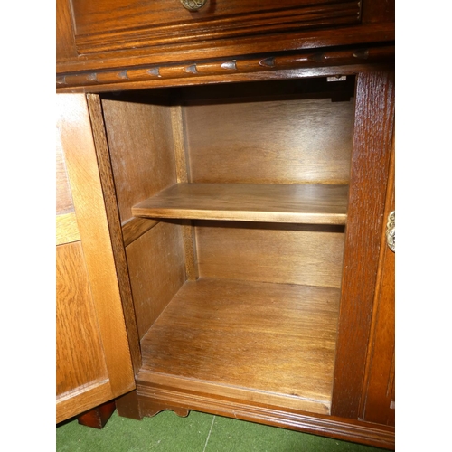 156 - A vintage Old Charm oak sideboard/ court cabinet.