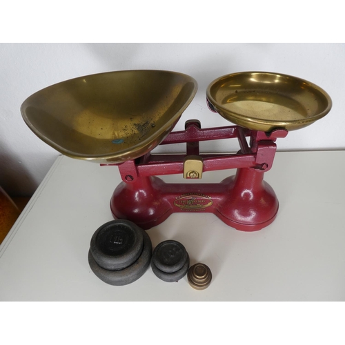 170 - A set of vintage kitchen scales with assortment of various weights.