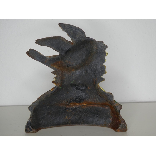 175 - A cast iron bird doorstop.