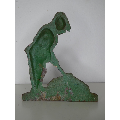 176 - A cast iron golfer door stop.