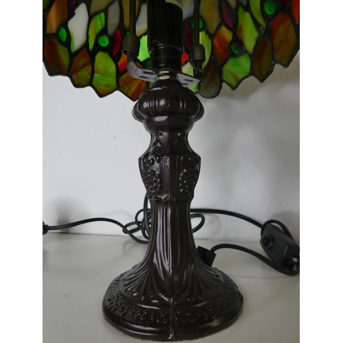 184 - A small Tiffany style table lamp with stained glass shade.