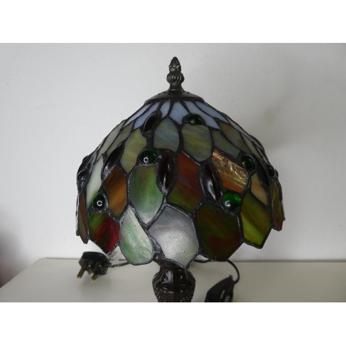 184 - A small Tiffany style table lamp with stained glass shade.