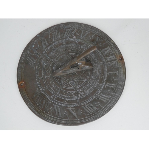 210 - A metal sun dial.