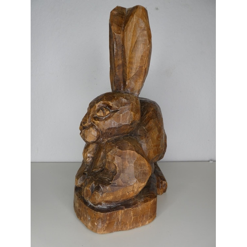 221 - A hand carved wooden rabbit.