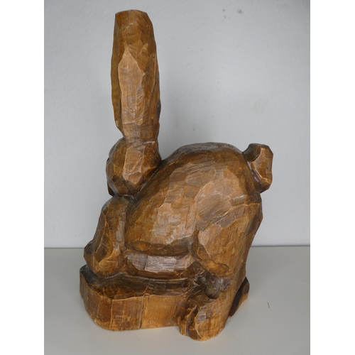 221 - A hand carved wooden rabbit.