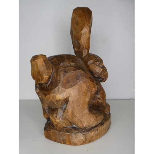 221 - A hand carved wooden rabbit.