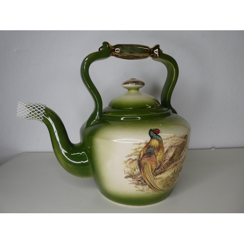 229 - A large decorative ceramic kettle.