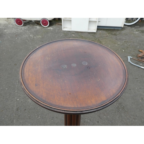 237 - An antique inlaid torchere/ plant stand on tripod base.