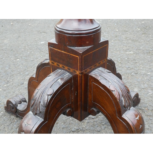 237 - An antique inlaid torchere/ plant stand on tripod base.