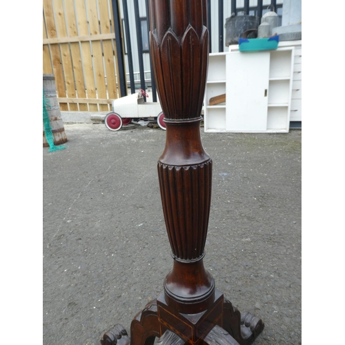 237 - An antique inlaid torchere/ plant stand on tripod base.