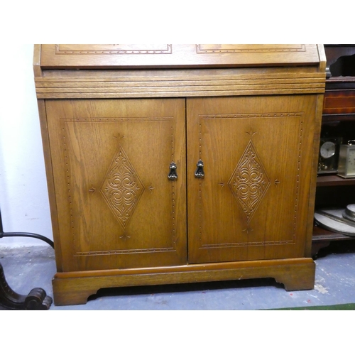 239 - A carved wooden writing bureau.