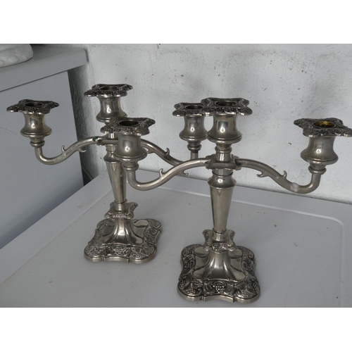 262 - A pair of 3 branch silver plated candelabras.