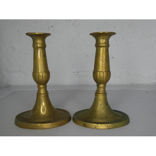 280 - A pair of vintage brass candlesticks.