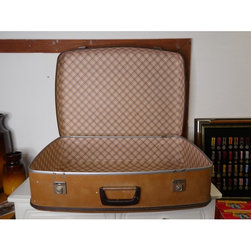 292 - A vintage/ retro suitcase.