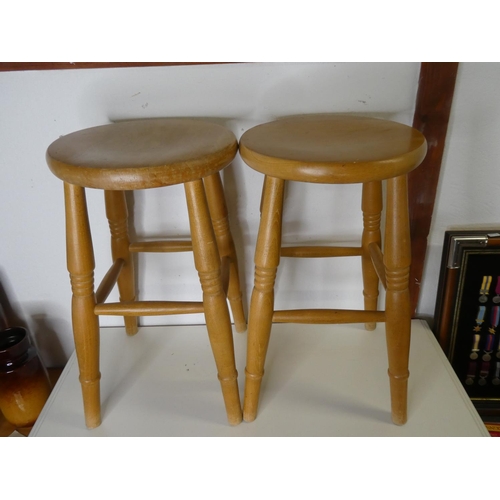 294 - A pair of wooden kitchen stools.