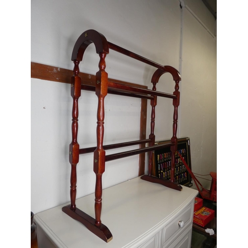 304 - A wooden towel rail.