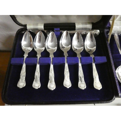 320 - An assortment of cased cutlery sets.