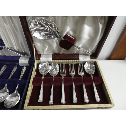 320 - An assortment of cased cutlery sets.