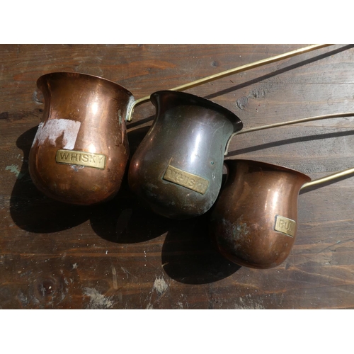 327 - A set of 3 antique copper spirit ladels.