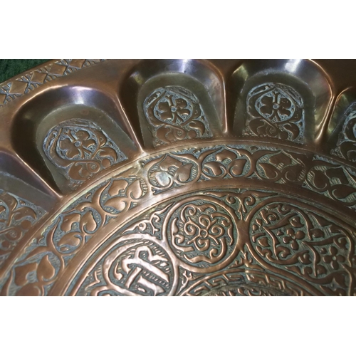 338 - A stunning & highly decorative Islamic tray with unusual indent design, measuring 38cm wide.