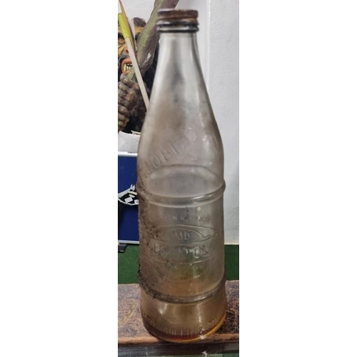 70 - A vintage glass Lobitol oil bottle which reads 'Linenhall St Belfast Holmes Miller & Dunn ltd).